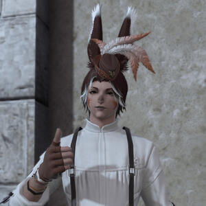 a headshot of my final fantasy 14 character Kihda. He is a male viera with dark red-brown hair and white highlights.